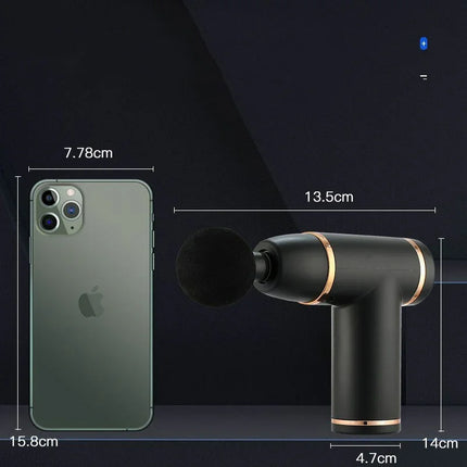 Black portable massage gun with gold accents, shown next to iPhone for scale, compact design for muscle relief