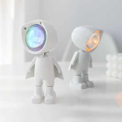 White astronaut-shaped night light with colorful LED glow, cute design for kids' room or desk decor