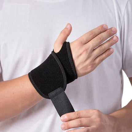 Black wrist support brace with thumb loop, adjustable strap for carpal tunnel or arthritis pain relief