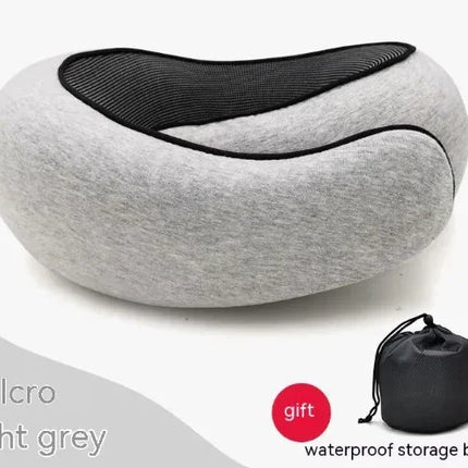 Light grey travel neck pillow with black mesh panel and Velcro closure, includes waterproof storage bag