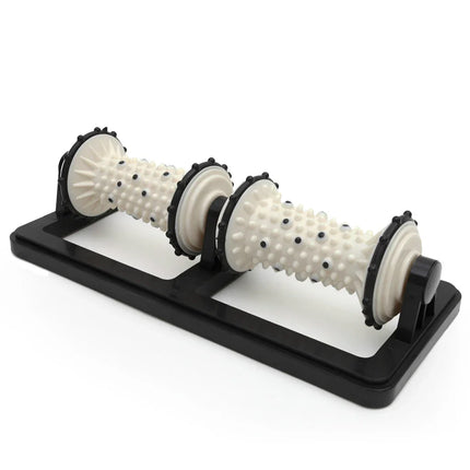 White spiky massage roller with black base for muscle relief and body therapy