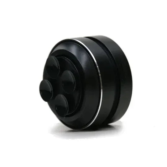 Black facial massager with 4 silicone nodes, sleek design for skincare and relaxation