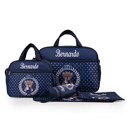 Personalized navy blue diaper bag set with polka dots, crown teddy bear design, and 'Bernardo' name embroidery