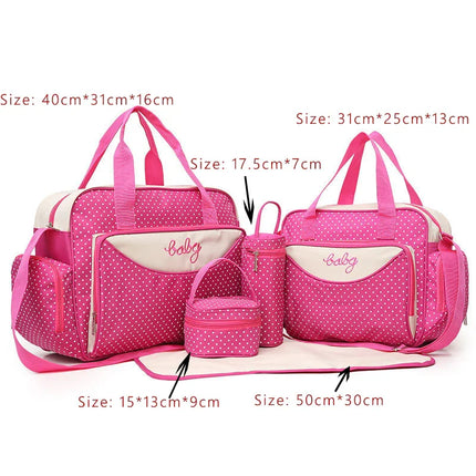 Pink polka dot baby diaper bag set with insulated bottle holder, changing mat, and organizer pockets