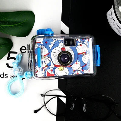 Blue Doraemon-themed disposable camera with clear case, strap, and lens detail for fun instant photos