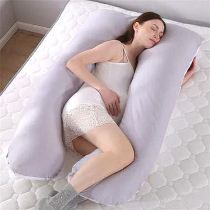 Gray U-shaped pregnancy body pillow supporting side sleeper, soft design for comfort and alignment