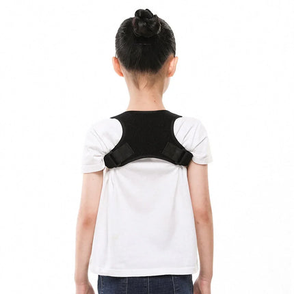 Black posture corrector brace with adjustable straps for back support, worn by child in white shirt