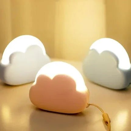 Cloud-shaped night light in pink, white, and blue with soft glow for kids' room decor