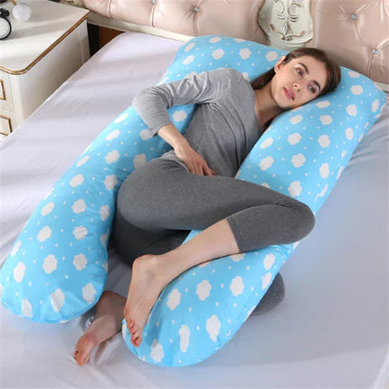 Blue cloud-print pregnancy pillow supporting side sleeper, full-body maternity comfort design