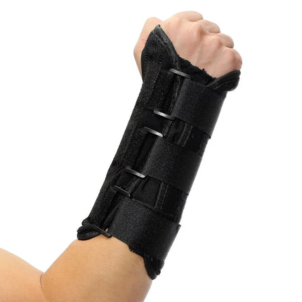 Black wrist brace with adjustable straps for support and stability, shown on clenched fist