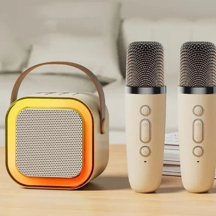 Portable karaoke speaker with dual microphones, gold accents, and beige design for home entertainment