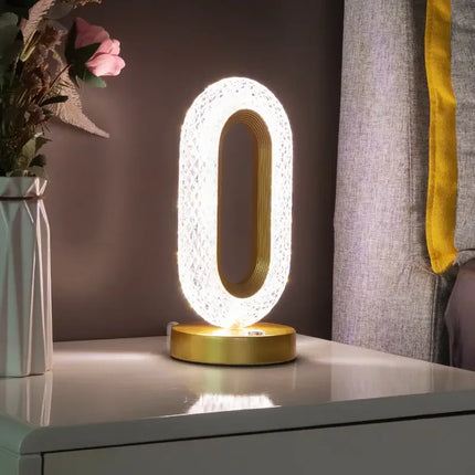 Modern gold LED table lamp with crystal design, perfect for bedside or desk lighting