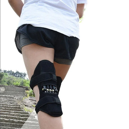 Black knee brace with adjustable straps and metal hinges for support during running or hiking