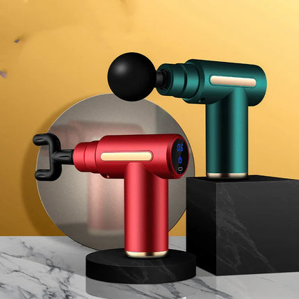 Red and green massage guns with digital displays, sleek design, on marble surface