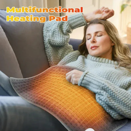 Multifunctional heating pad with warm glow, used for relaxation on sofa, gray textured design