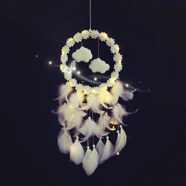 White dreamcatcher with daisy flowers, cloud charms, and glowing lights for bedroom decor