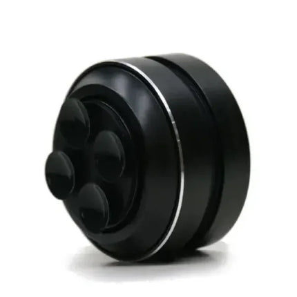 Black massage roller with silver accents and ergonomic design for muscle relief