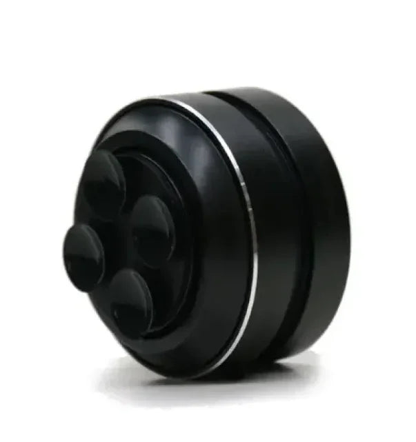 Black massage roller with silver accents and ergonomic design for muscle relief