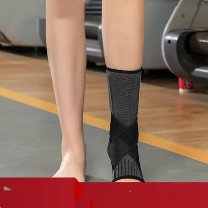 Black and gray ankle support brace with breathable mesh and crisscross straps for stability during workouts