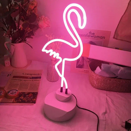 Pink neon flamingo lamp with white base, stylish room decor lighting