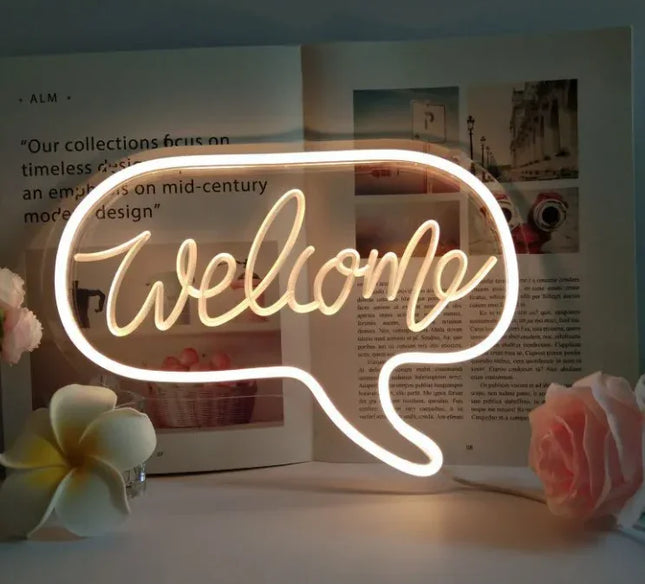 Glowing neon 'Welcome' sign in speech bubble design, warm white light, modern decor accent