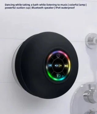 Black waterproof Bluetooth speaker with rainbow LED light, suction cup design for bath use