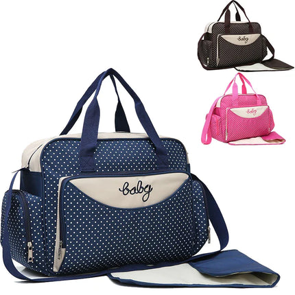Navy blue polka dot baby diaper bag with changing pad, multiple pockets, and 'baby' embroidery