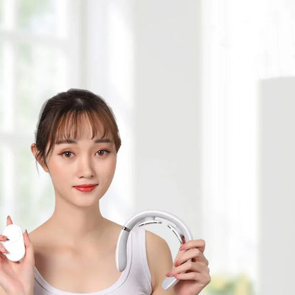 White neck massager with remote control, sleek design for relaxation and muscle relief