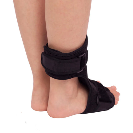 Black ankle brace with adjustable straps for support and stability, worn on foot and lower leg