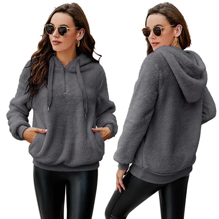 Woman wearing long sleeve zipper hooded fleece sweatshirt jacket in solid color casual style