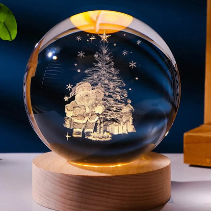 Clear crystal snow globe with etched Santa and Christmas tree, warm LED base, festive holiday decor
