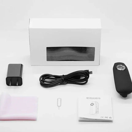 Black portable USB charger with cable, adapter, SIM tool, cleaning cloth, and manual – compact travel power bank