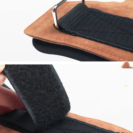 Black velcro strap with metal buckle on brown suede, adjustable closure for bags or gear