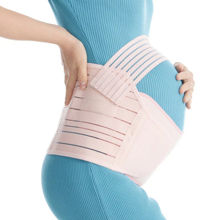 Pink maternity support belt with breathable straps, worn for pregnancy back pain relief and belly support