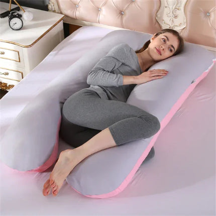 Gray and pink full-body pregnancy pillow with ergonomic design for side sleeping comfort