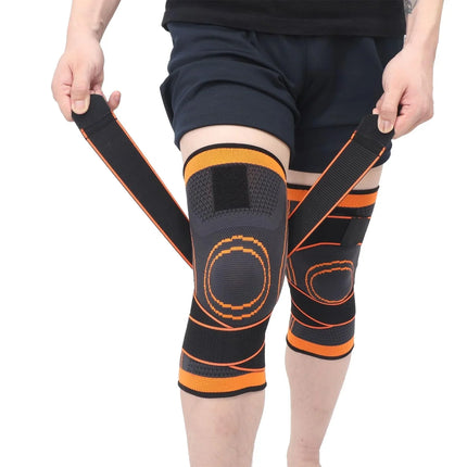 Black and orange knee brace with adjustable straps for support and compression during sports or recovery