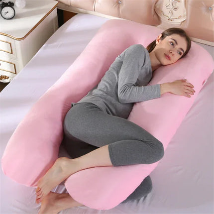 Pink full-body pregnancy pillow for side sleeping, supportive U-shape design, soft plush fabric