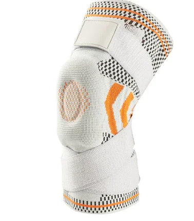 White and orange knee brace with breathable mesh, adjustable straps, and support padding for joint stability